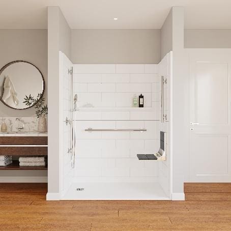 A white shower stall with a bench seat.