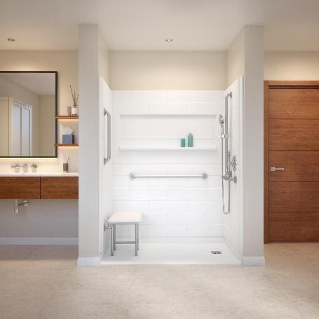 A bathroom with a walk in shower and a mirror.